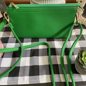 Small crossbody Kelly Green bag. Measures 9 1/2 X 5.
